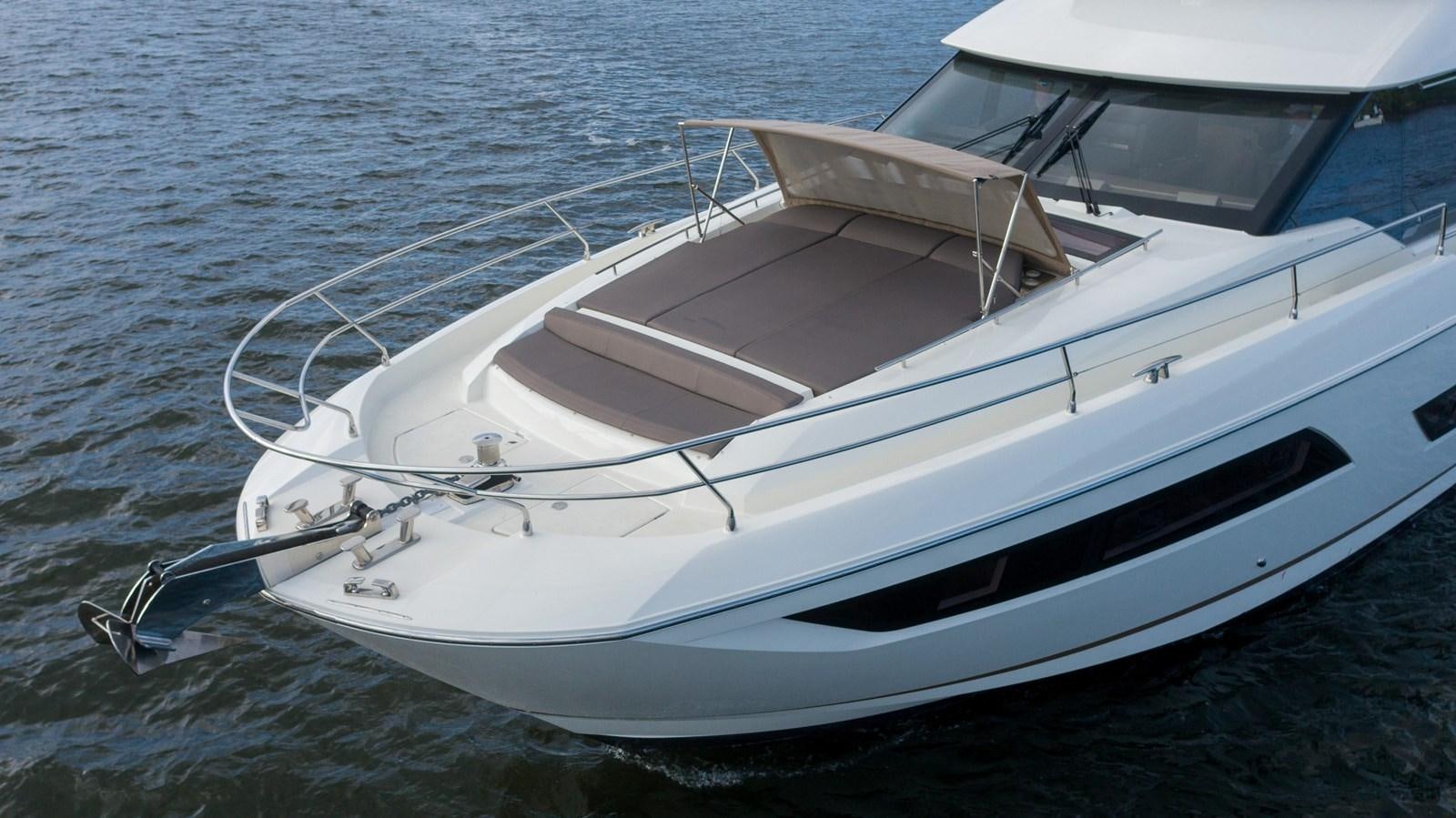 a white boat on the water aboard VIMA Yacht for Sale