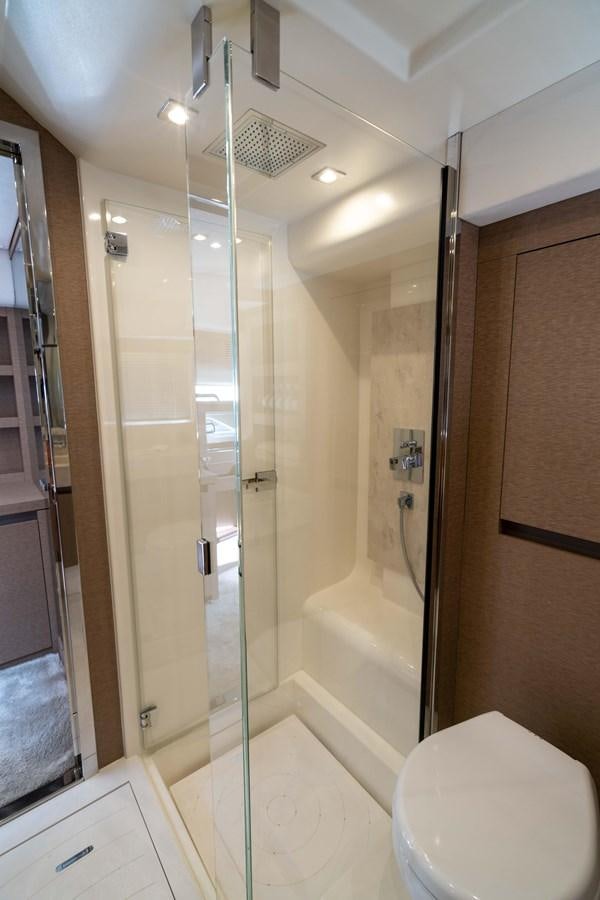 a bathroom with a glass shower aboard VIMA Yacht for Sale