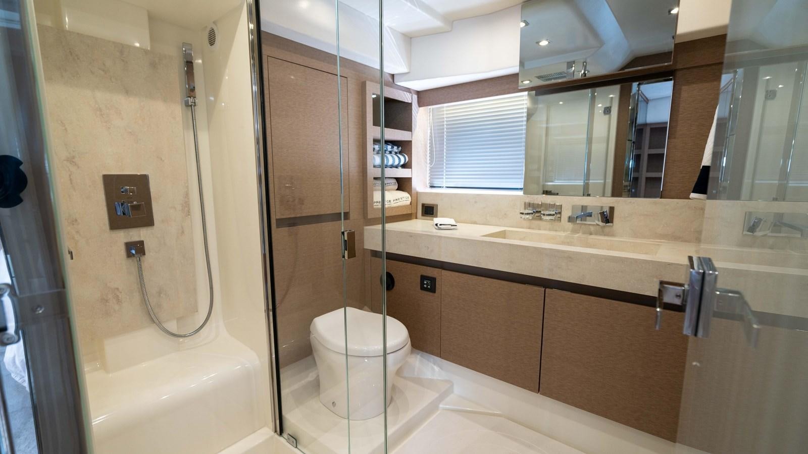 a bathroom with a glass shower aboard VIMA Yacht for Sale