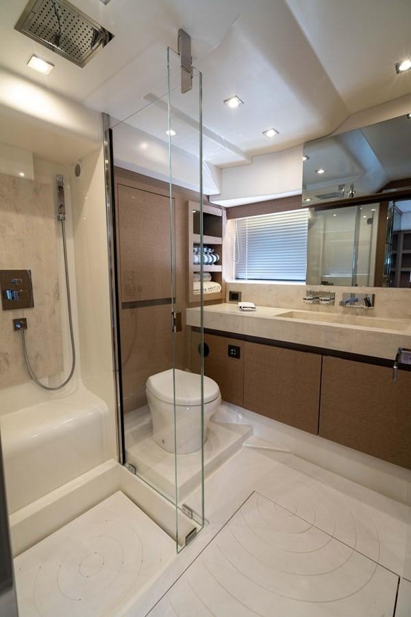 a bathroom with a glass shower aboard VIMA Yacht for Sale