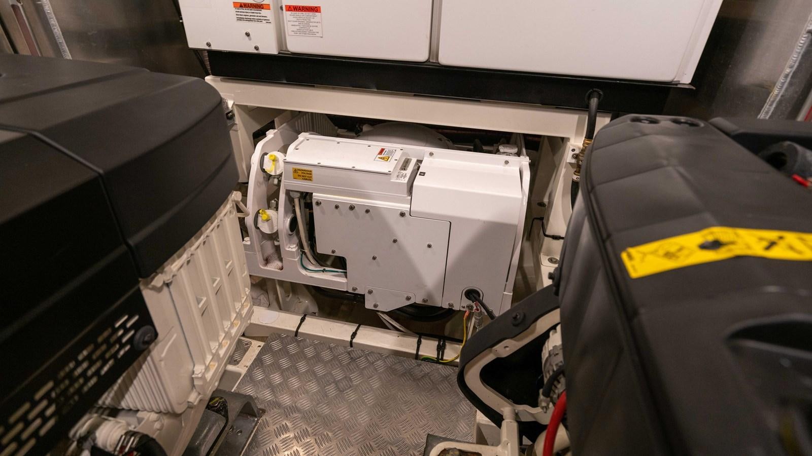 a car with a large piece of equipment in it aboard VIMA Yacht for Sale