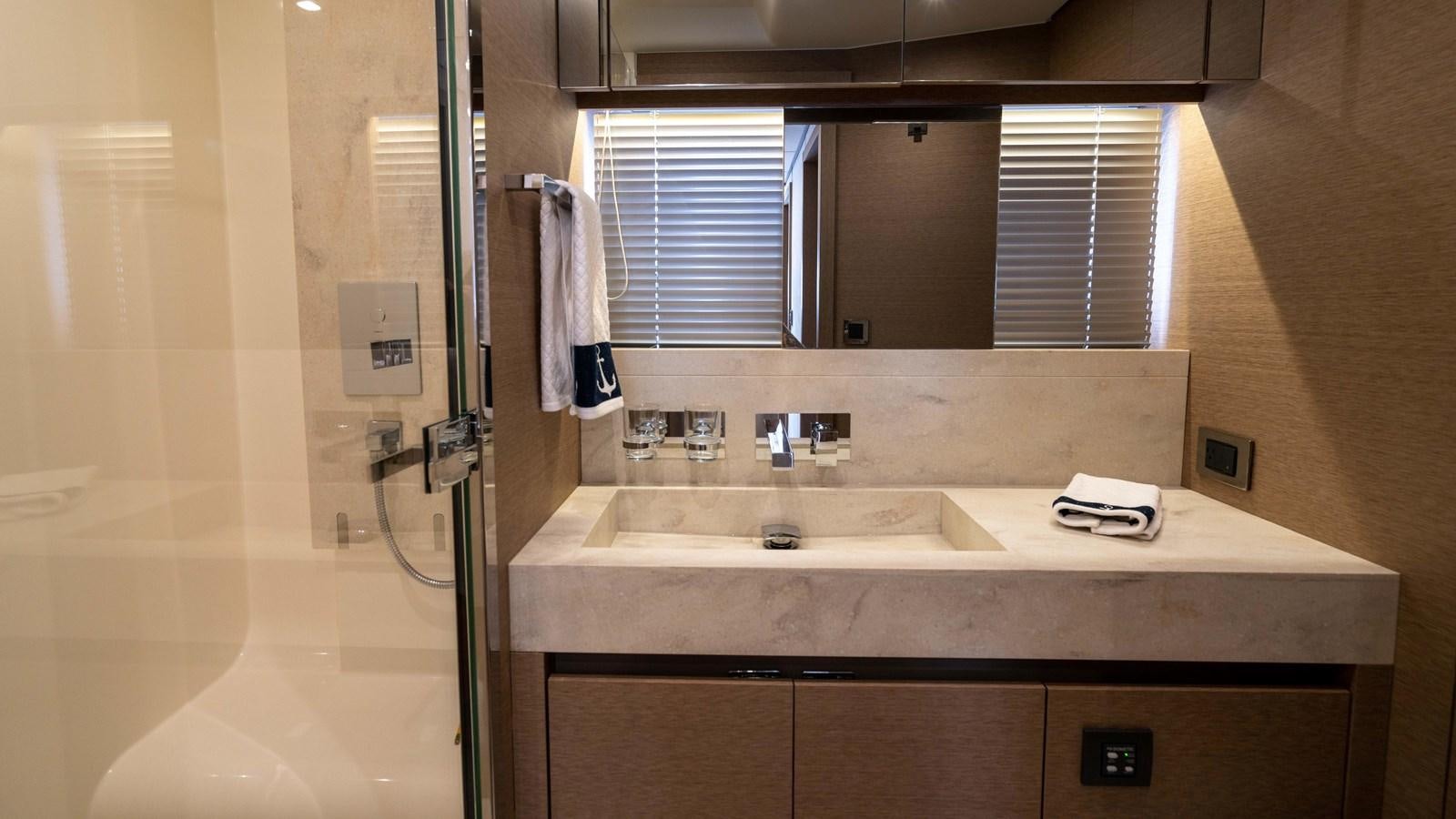 a bathroom with a sink and a shower aboard VIMA Yacht for Sale