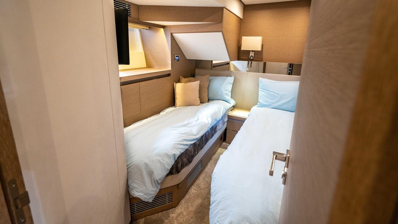 a room with two beds aboard VIMA Yacht for Sale