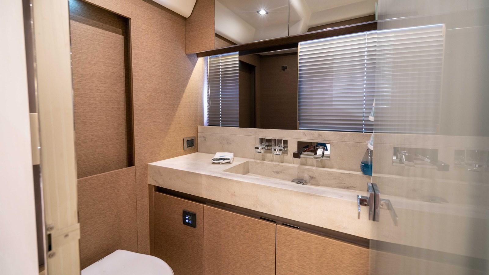a bathroom with a sink and a mirror aboard VIMA Yacht for Sale
