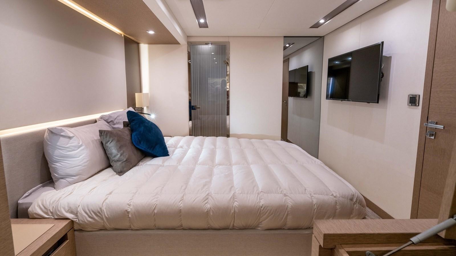 a bed in a room aboard VIMA Yacht for Sale