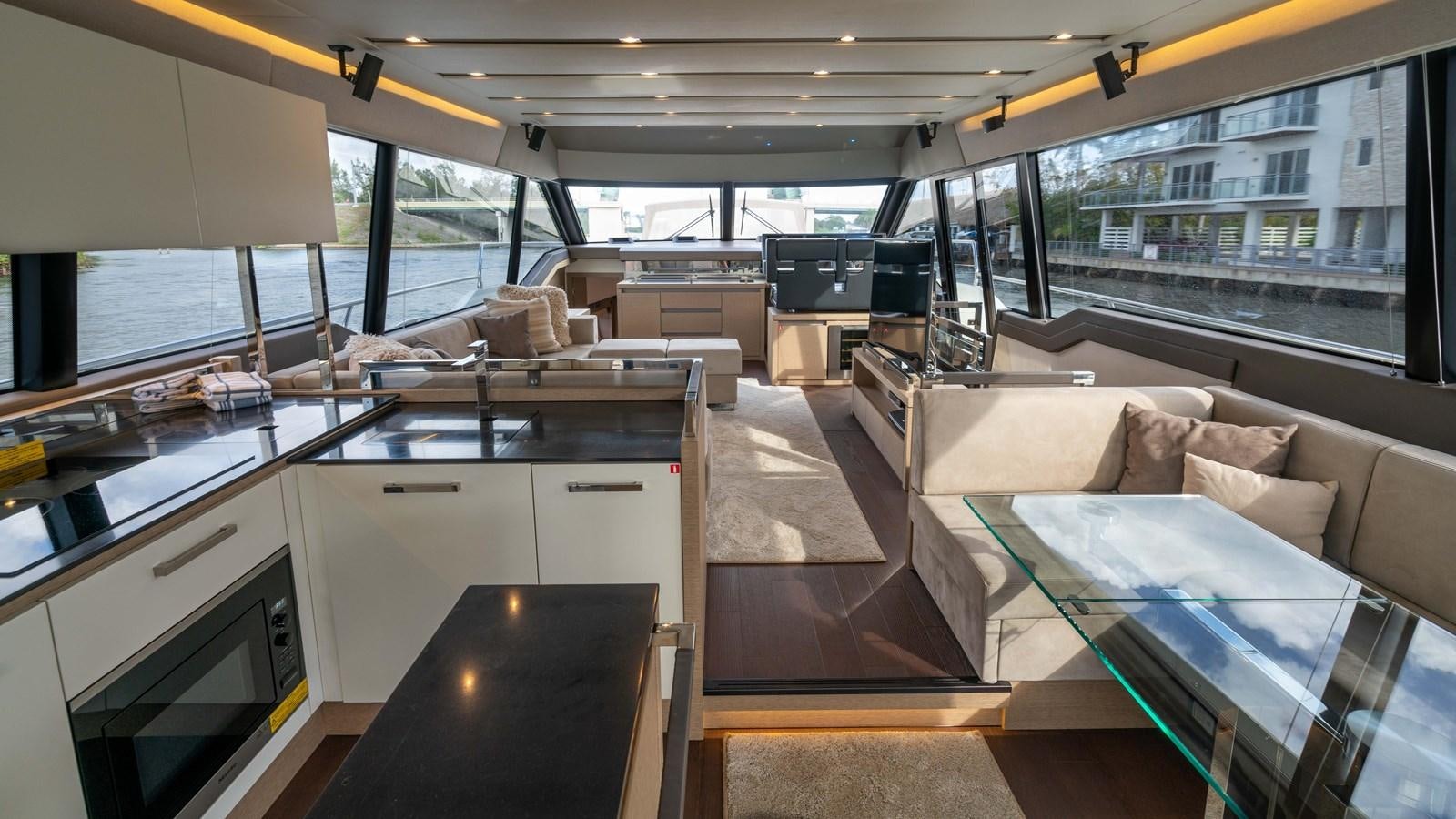 a room with a couch and a table aboard VIMA Yacht for Sale