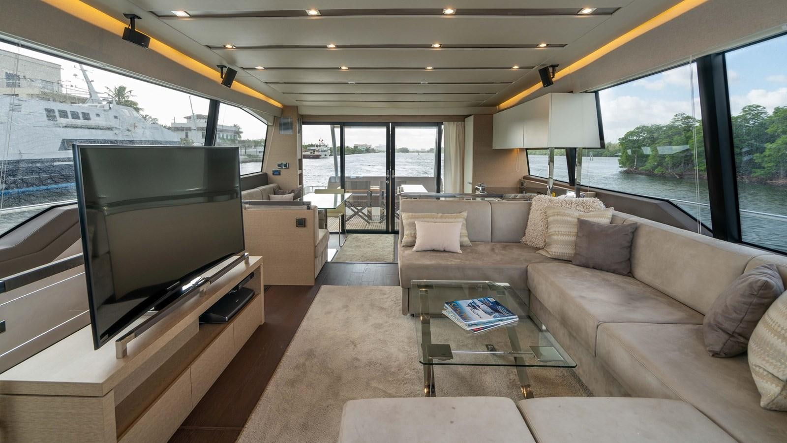 a living room with a couch and a tv aboard VIMA Yacht for Sale