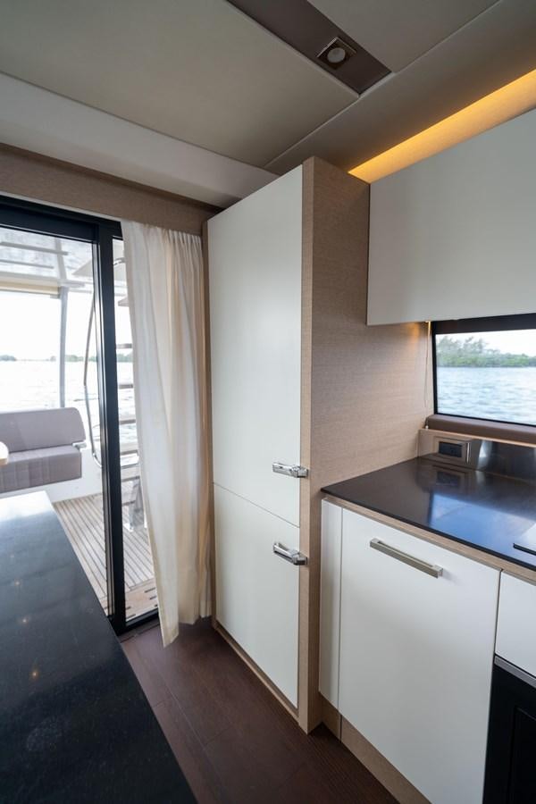 a room with a door and a window aboard VIMA Yacht for Sale