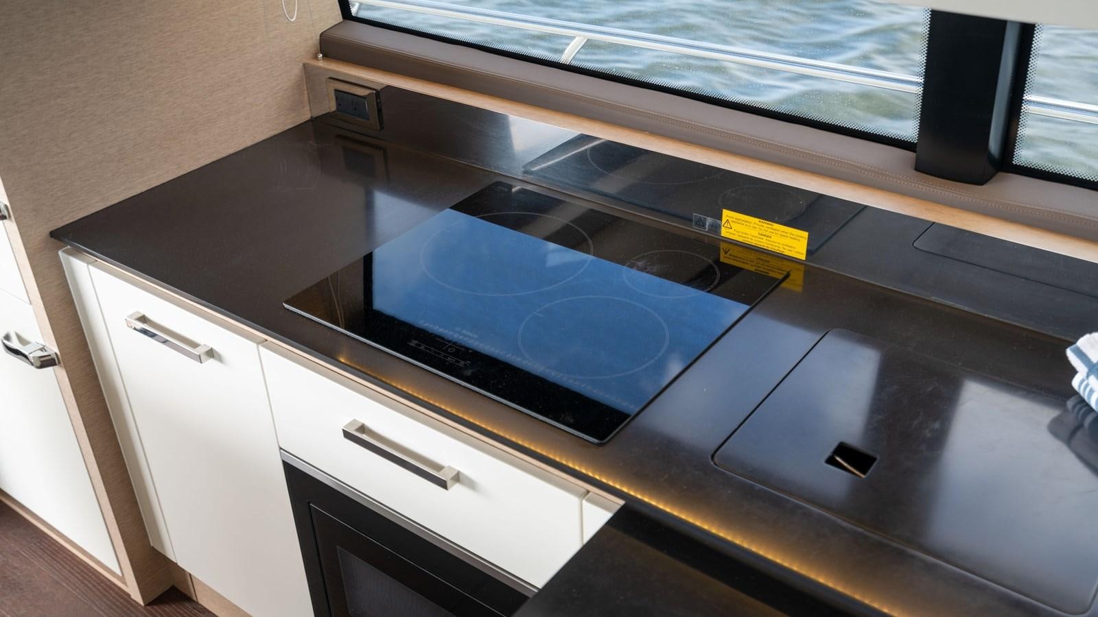 a large blue rectangular object on a counter aboard VIMA Yacht for Sale