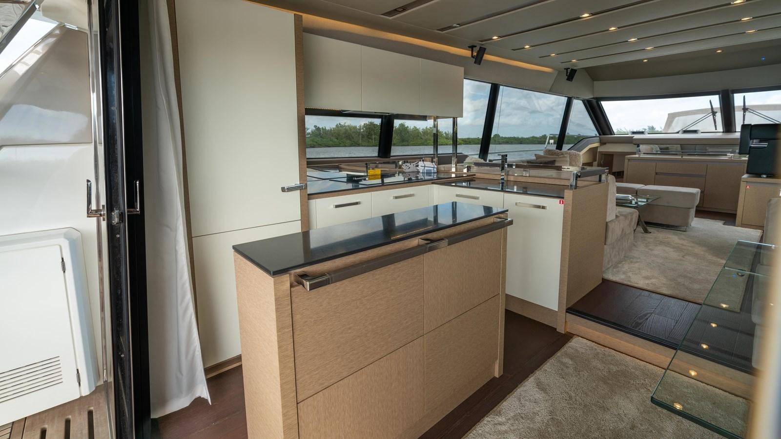 a kitchen with a counter and cabinets aboard VIMA Yacht for Sale