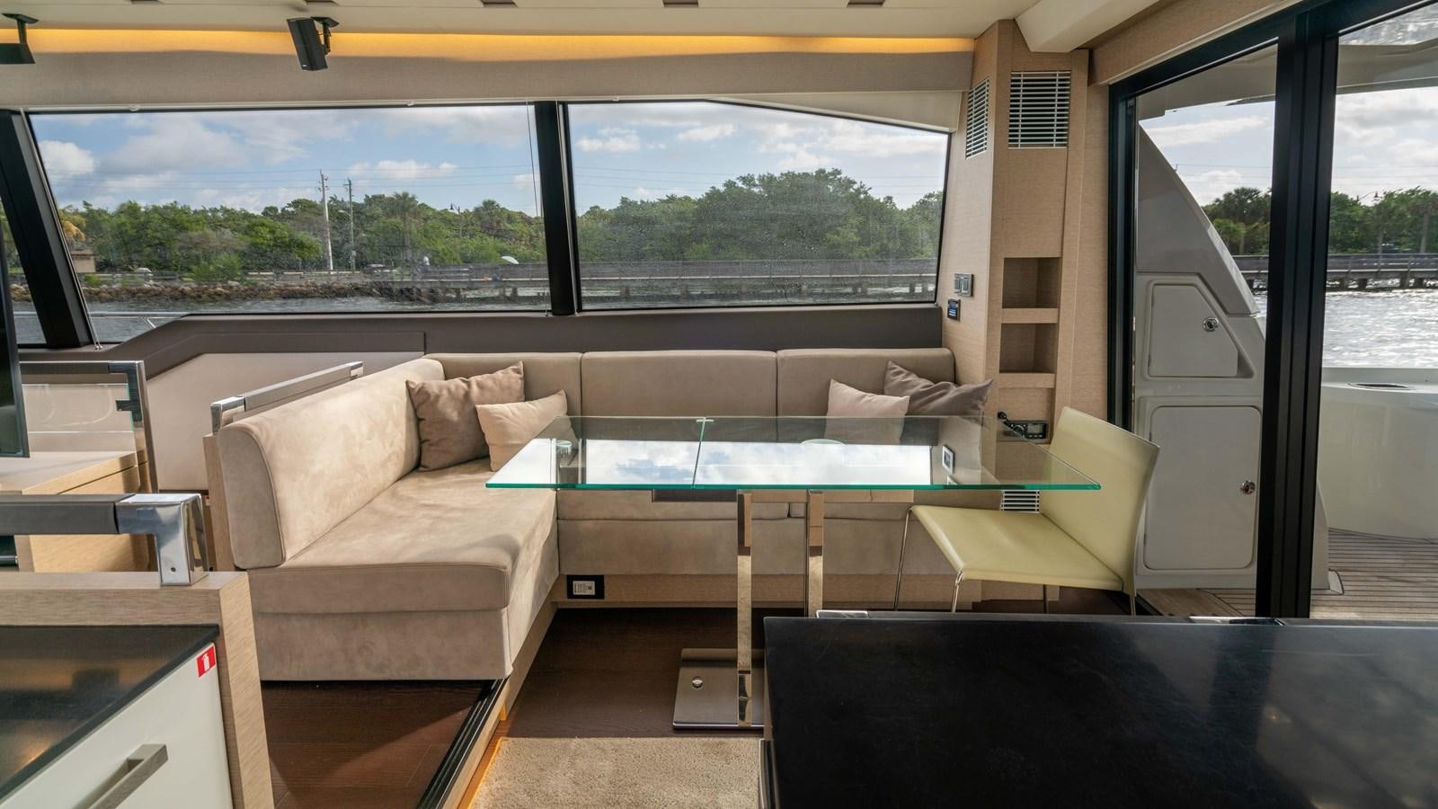 a room with a couch and a table aboard VIMA Yacht for Sale