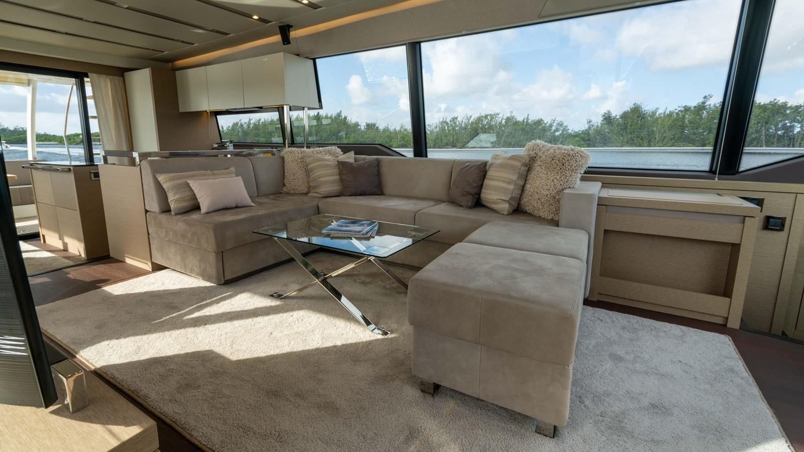 a living room with a couch and a coffee table aboard VIMA Yacht for Sale