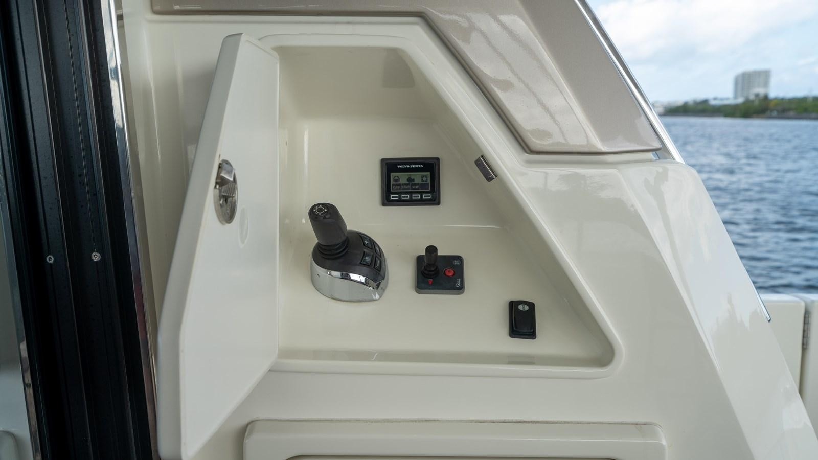 a boat with a steering wheel and dashboard aboard VIMA Yacht for Sale
