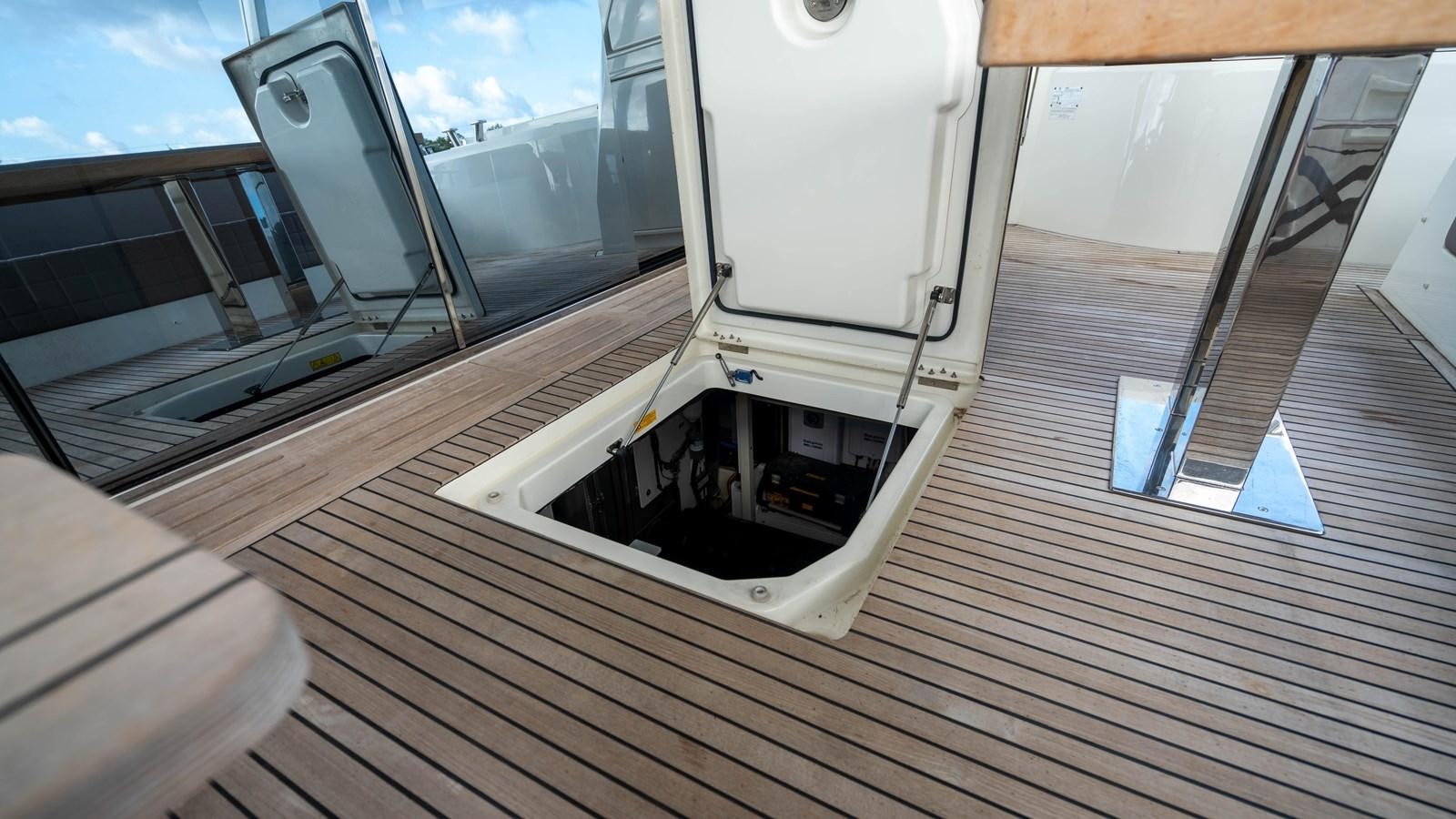 a boat on a deck aboard VIMA Yacht for Sale