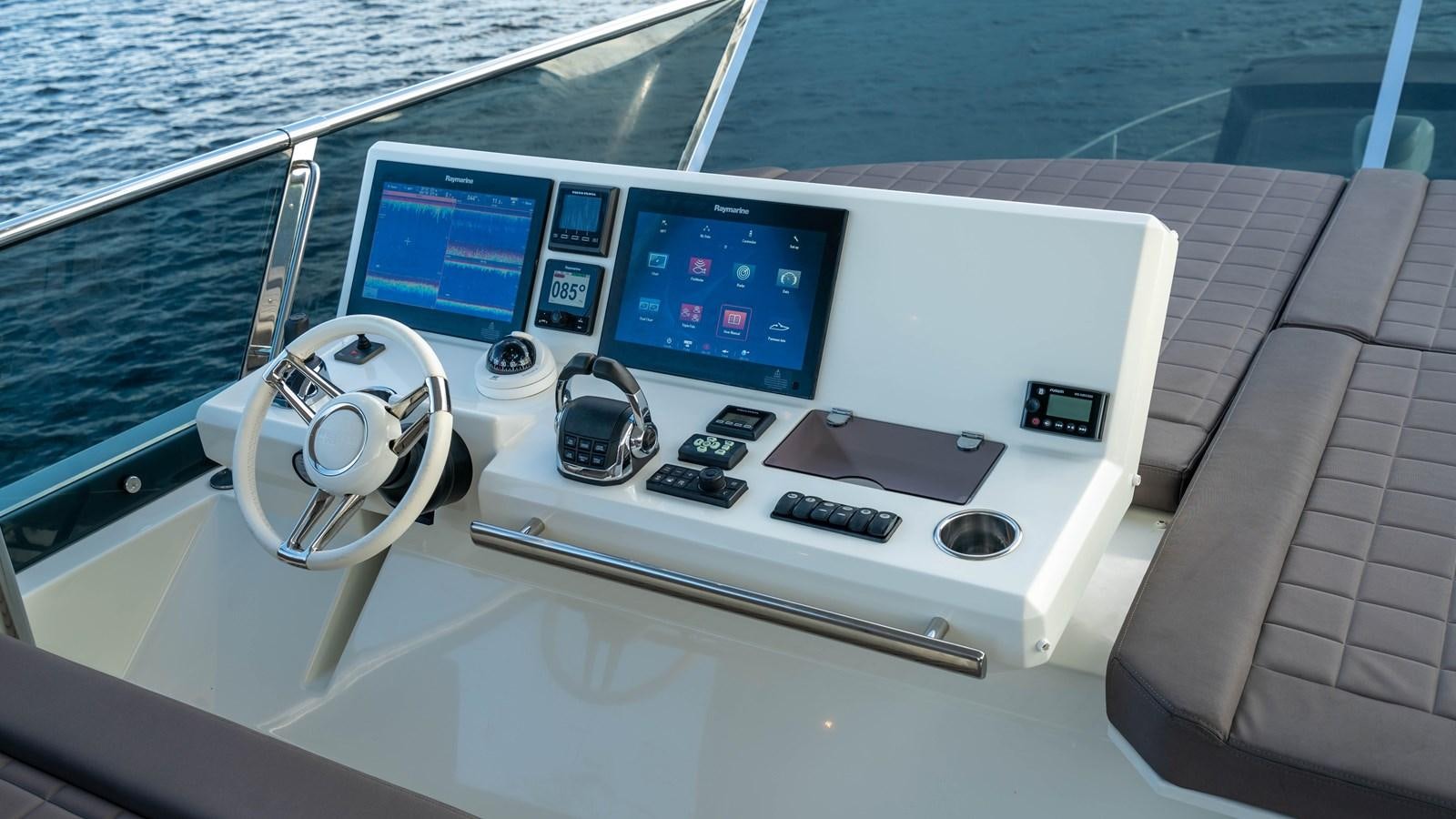 a boat with a screen and buttons aboard VIMA Yacht for Sale