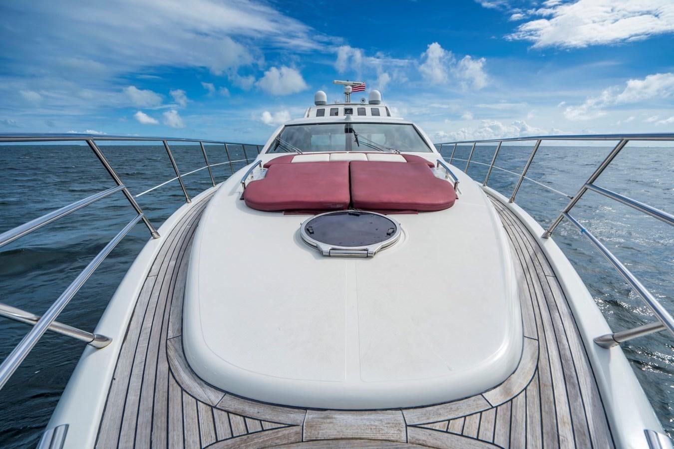 a white car on a bridge aboard KNOTORIOUS IV Yacht for Sale