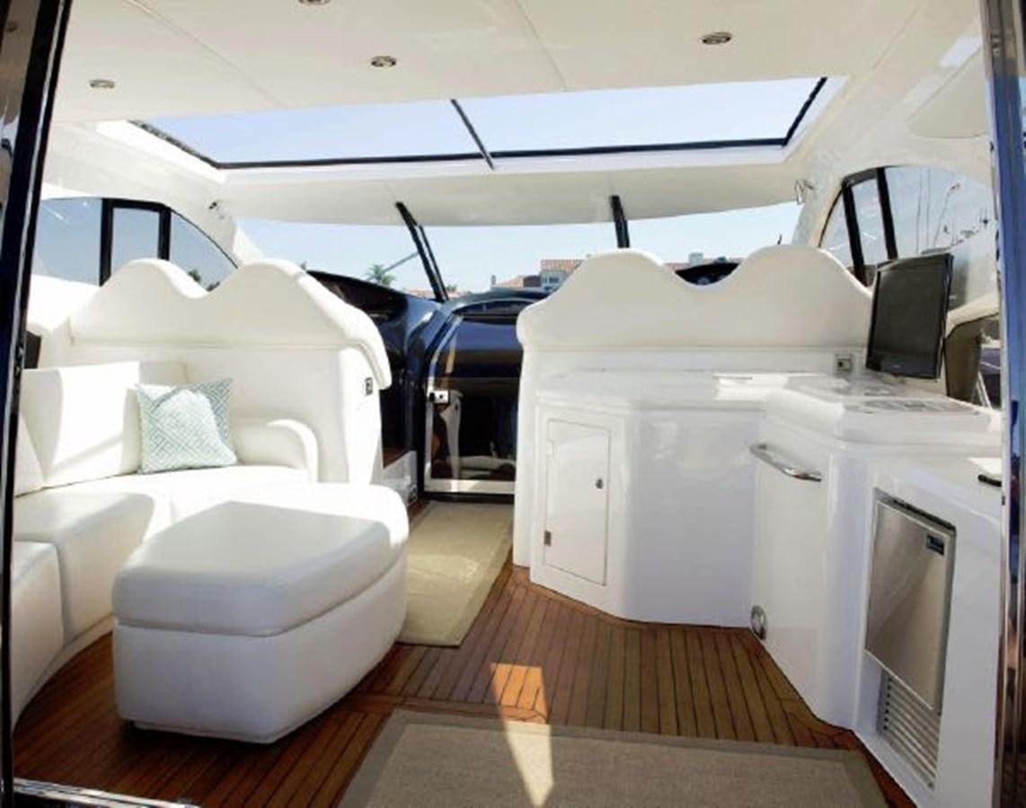 a room with a bed and a chair aboard SONSEEKER Yacht for Sale