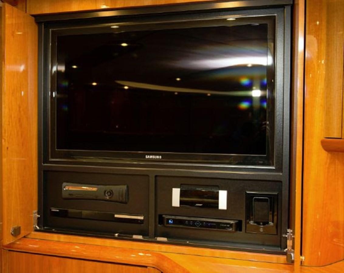 a tv on a cabinet aboard SONSEEKER Yacht for Sale