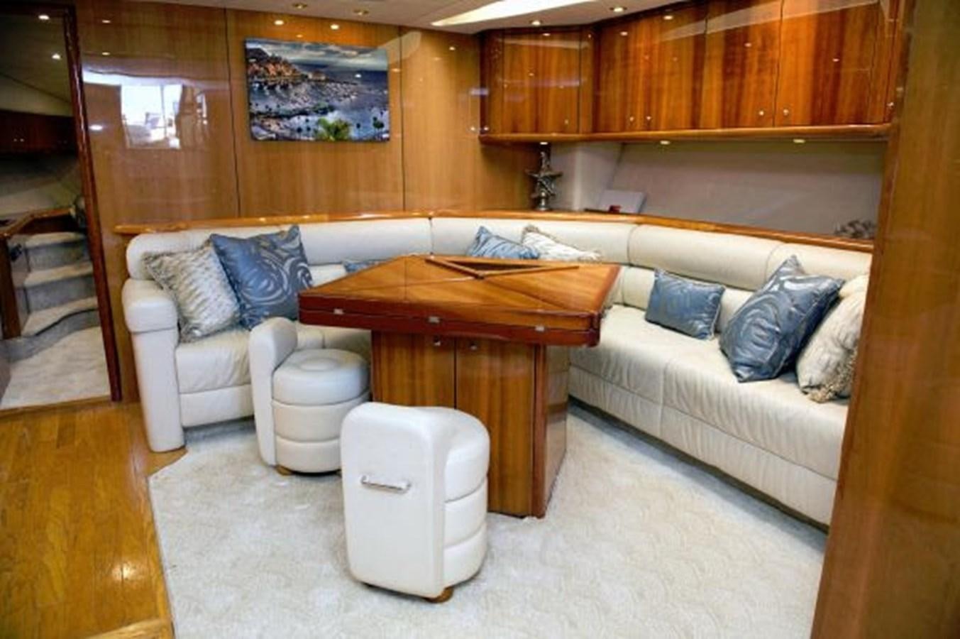 a living room with a couch and a table aboard SONSEEKER Yacht for Sale
