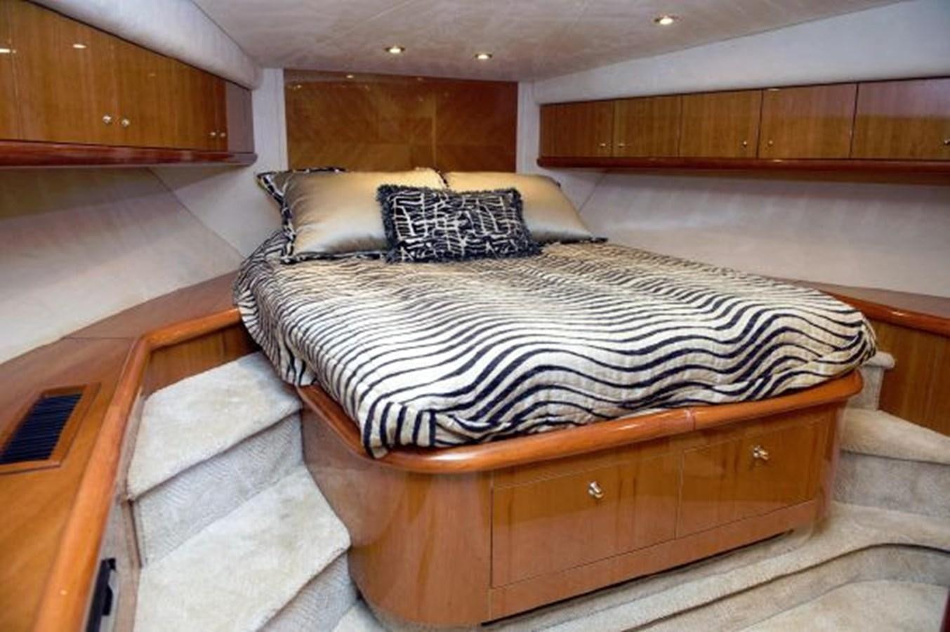 a bed in a room aboard SONSEEKER Yacht for Sale