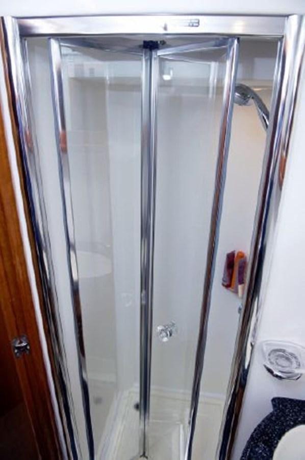 a silver door with a handle aboard SONSEEKER Yacht for Sale