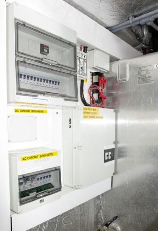 a white machine with a yellow label aboard SONSEEKER Yacht for Sale