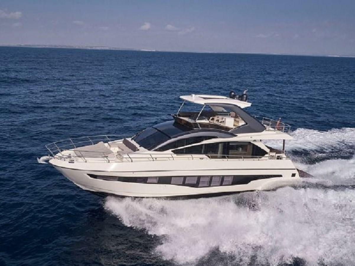 a boat on the water aboard 2021 ASTONDOA 66 FLYBRIDGE Yacht for Sale