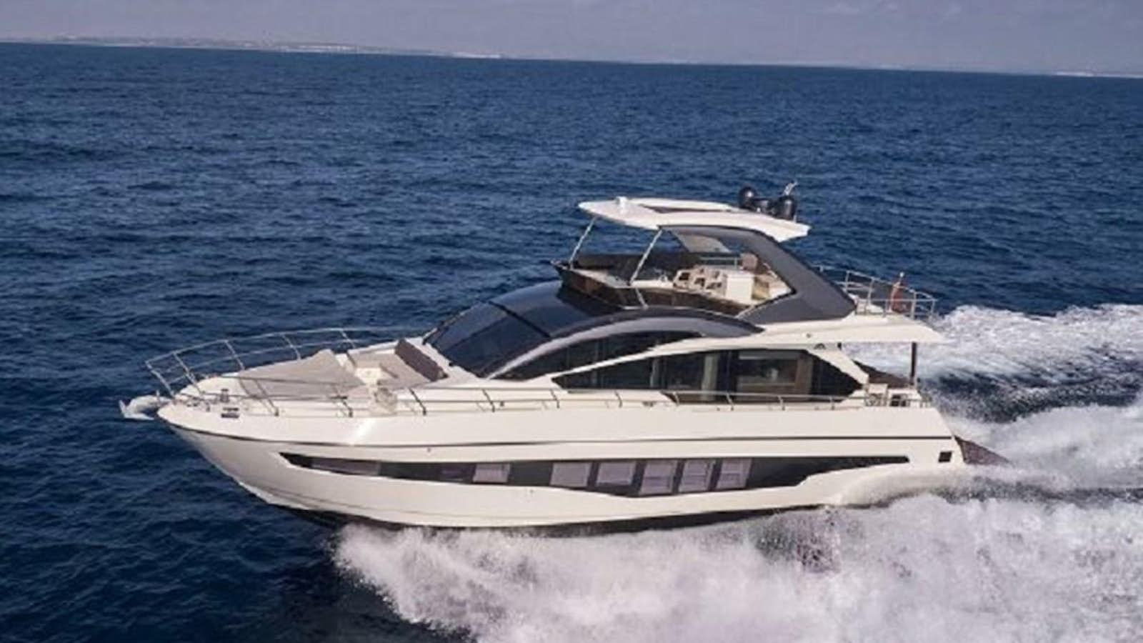a boat on the water aboard 2021 ASTONDOA 66 FLYBRIDGE Yacht for Sale