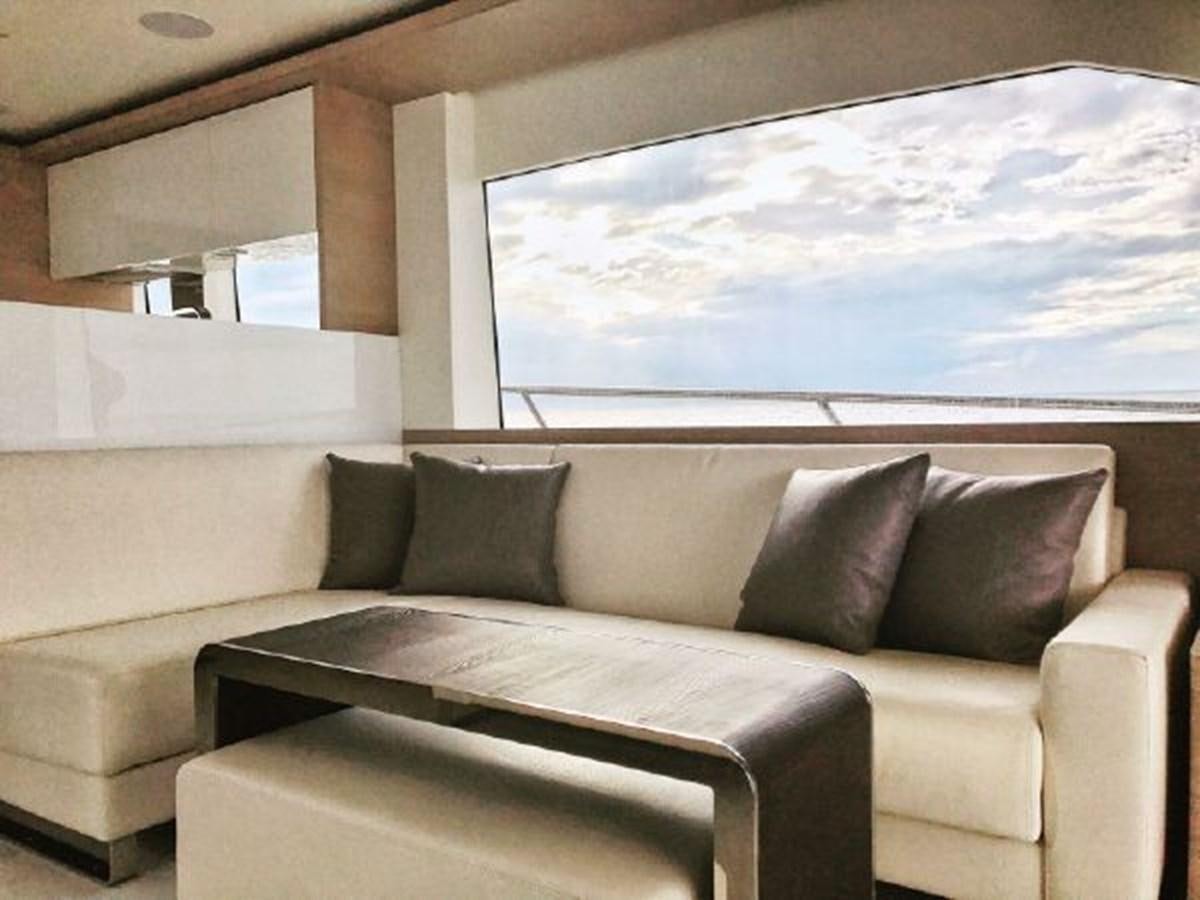 a couch with pillows aboard 2021 ASTONDOA 66 FLYBRIDGE Yacht for Sale