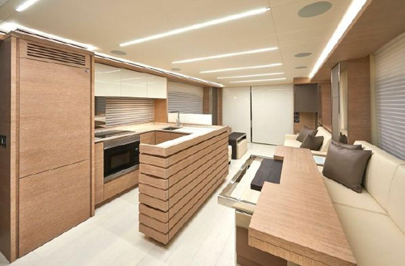 a room with a couch and a table and a tv aboard 2021 ASTONDOA 66 FLYBRIDGE Yacht for Sale
