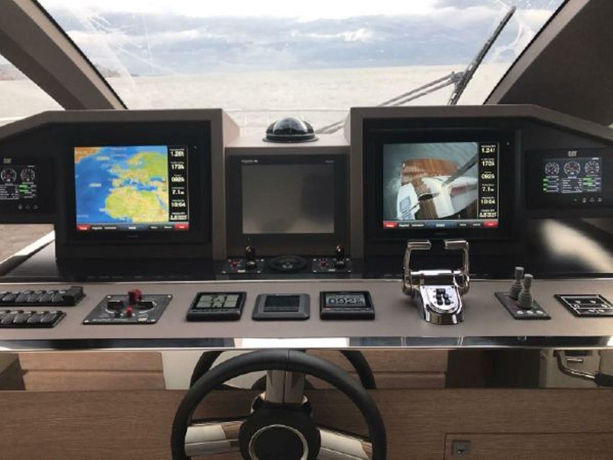 a group of monitors on a table aboard 2021 ASTONDOA 66 FLYBRIDGE Yacht for Sale