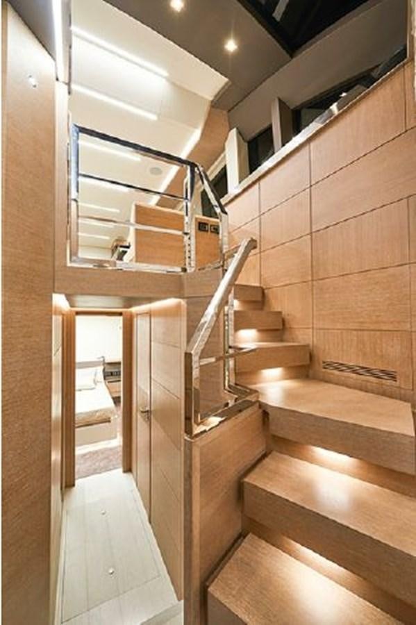 a staircase with wooden walls aboard 2021 ASTONDOA 66 FLYBRIDGE Yacht for Sale