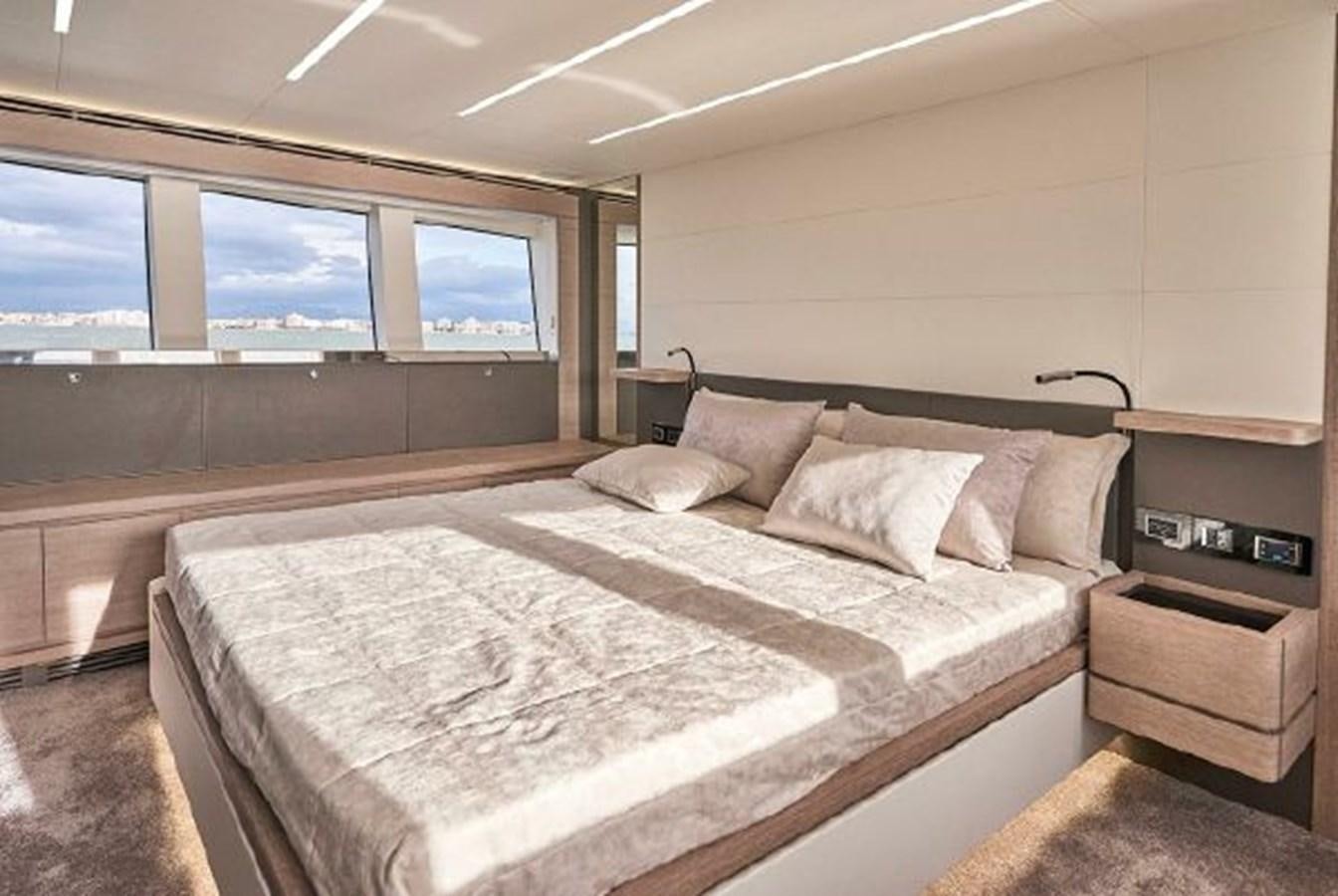 a room with a bed and a window aboard 2021 ASTONDOA 66 FLYBRIDGE Yacht for Sale