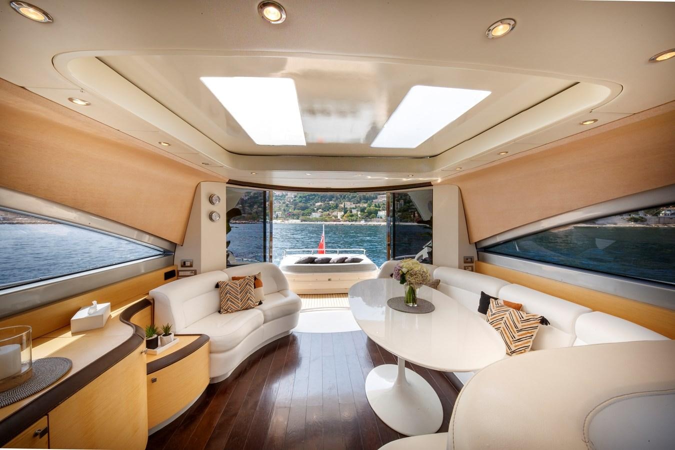 a living room with a large window aboard KOKAB Yacht for Charter