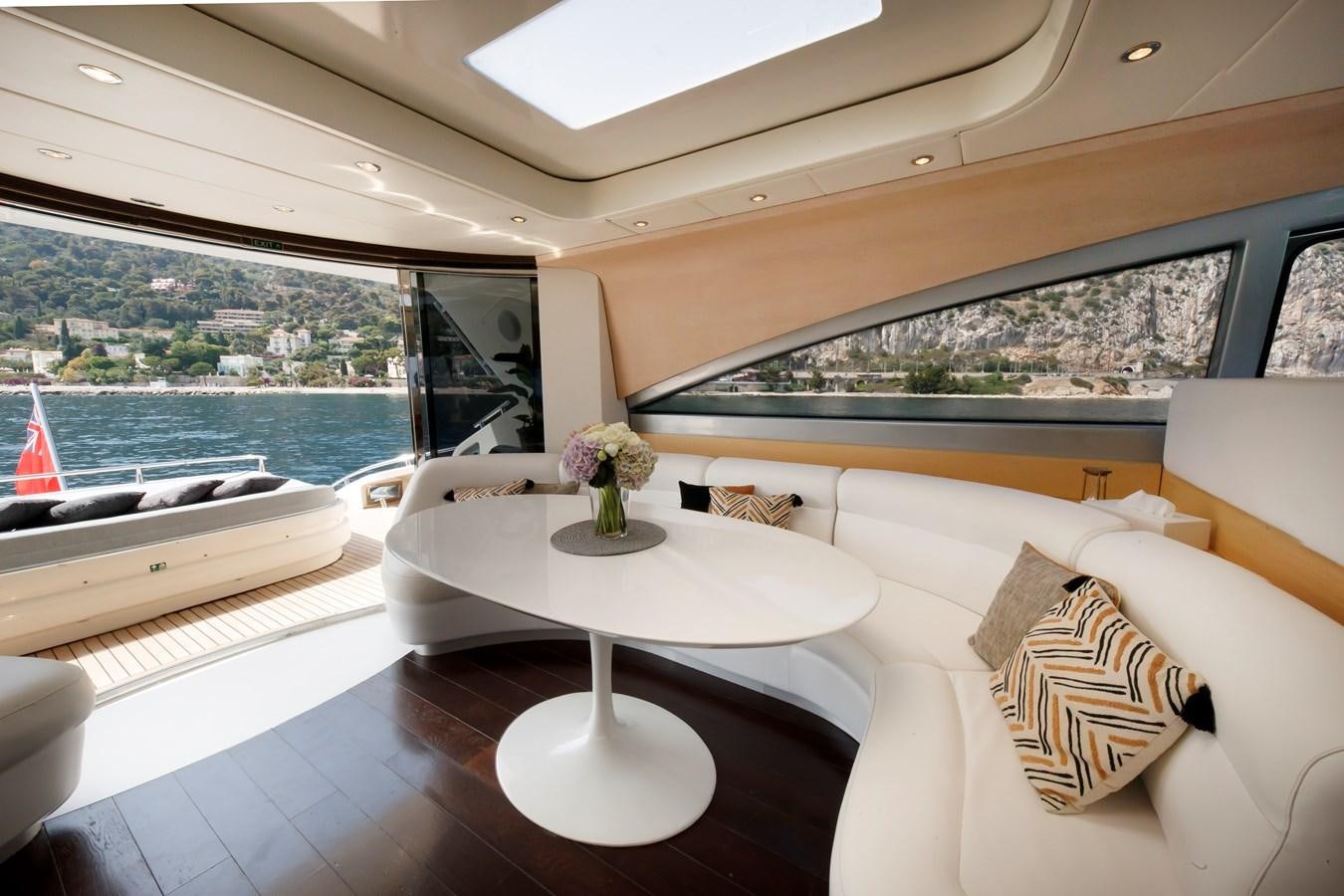 a room with a couch and a table aboard KOKAB Yacht for Charter