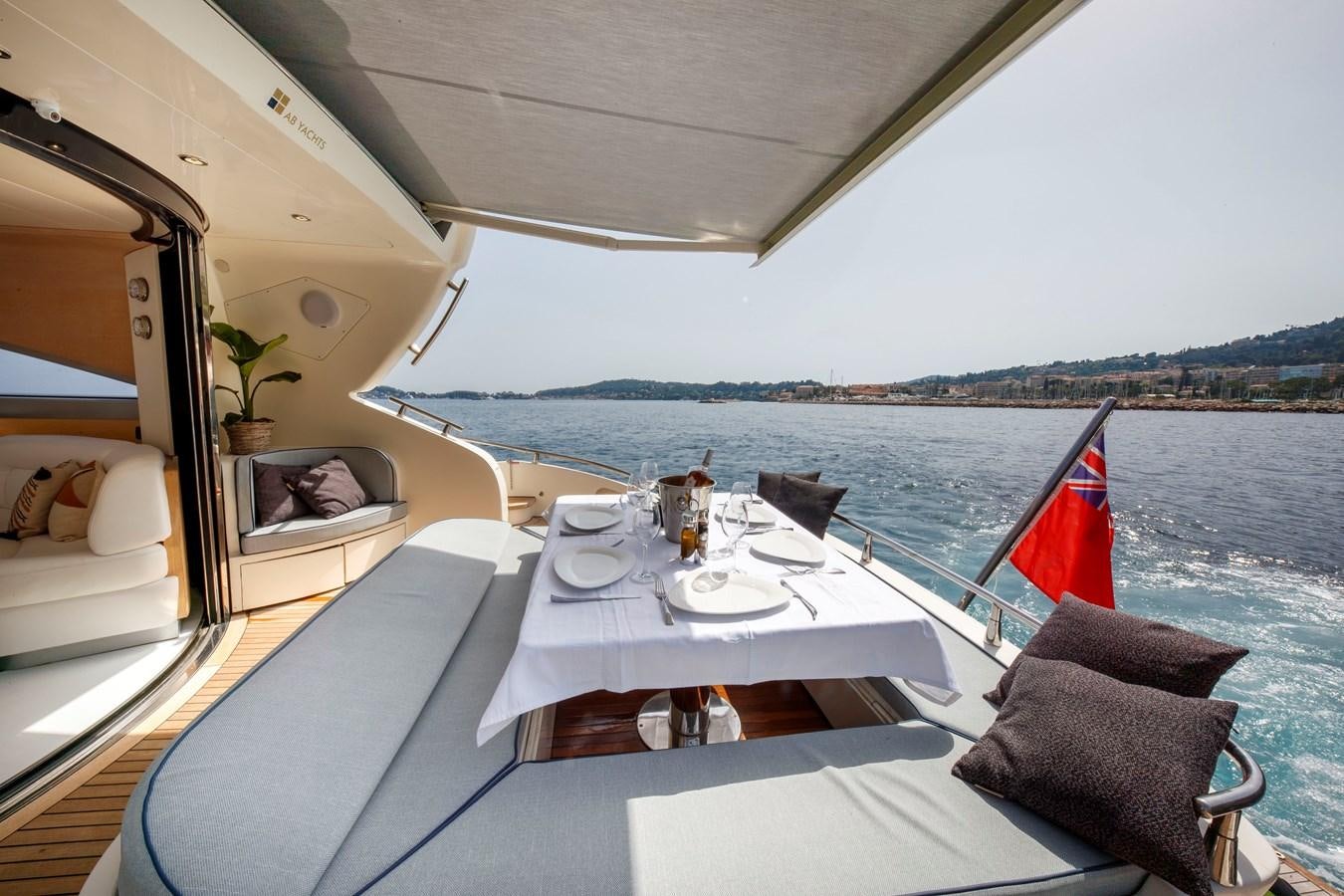 a table with chairs on it aboard KOKAB Yacht for Charter
