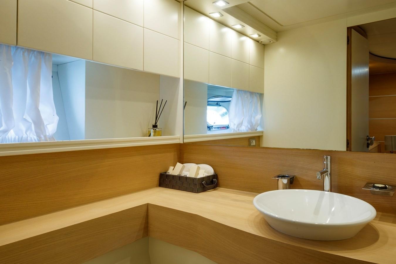 a bathroom with a large mirror aboard KOKAB Yacht for Charter