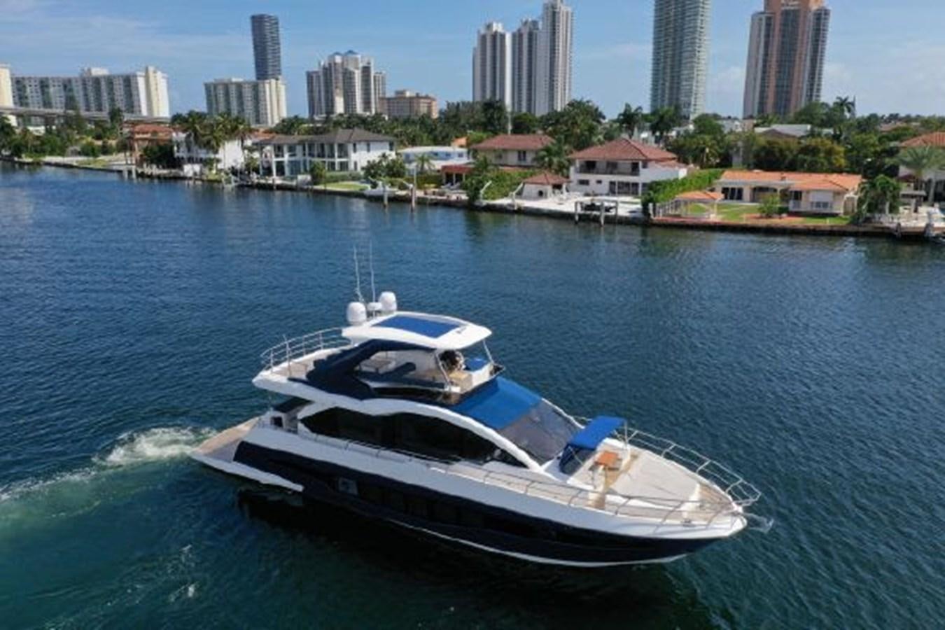a boat on the water aboard THE ONLY BLUE 66 FLY Yacht for Sale