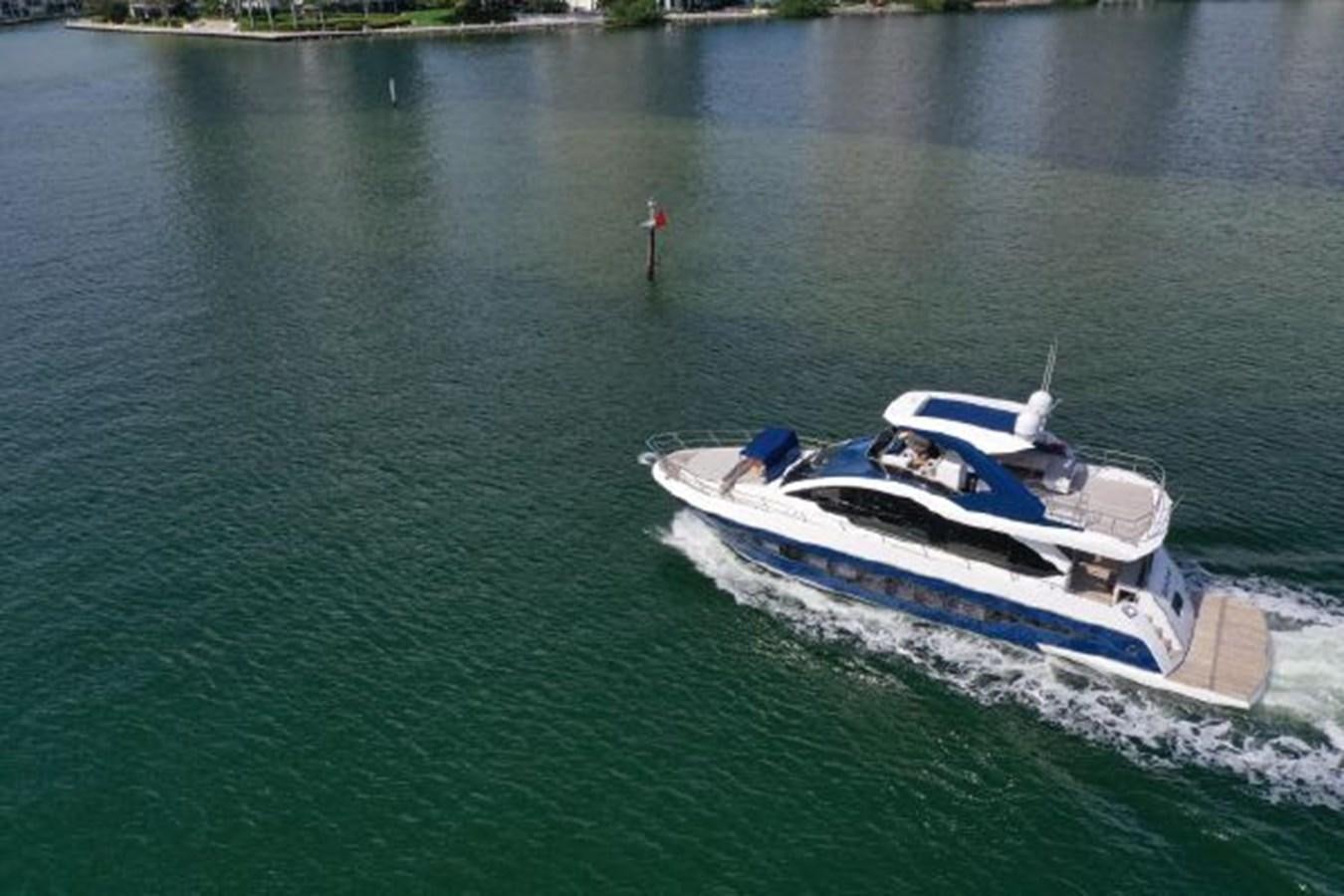 a boat on the water aboard THE ONLY BLUE 66 FLY Yacht for Sale