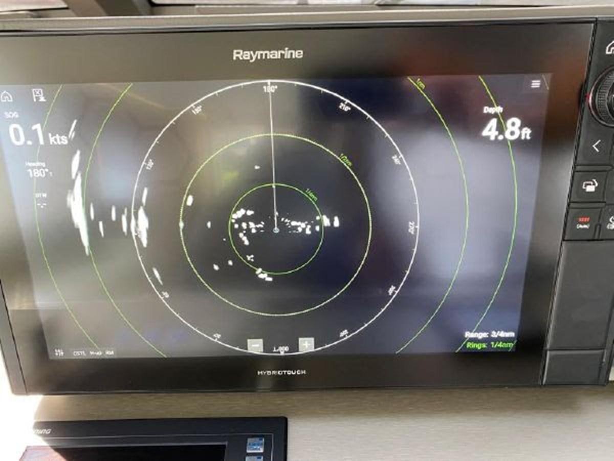 a computer screen with a blue circle aboard THE ONLY BLUE 66 FLY Yacht for Sale