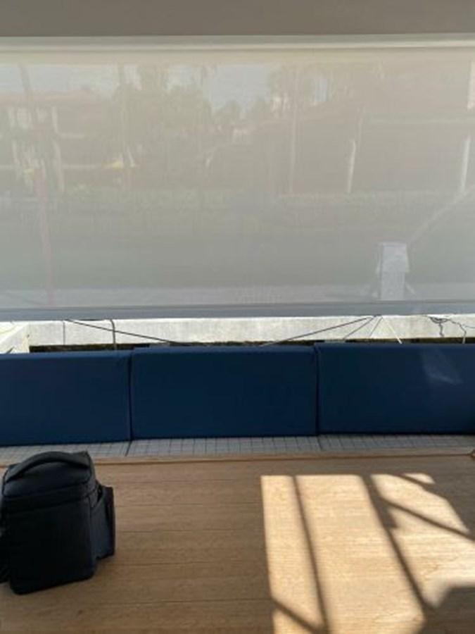 a luggage bag next to a window aboard THE ONLY BLUE 66 FLY Yacht for Sale