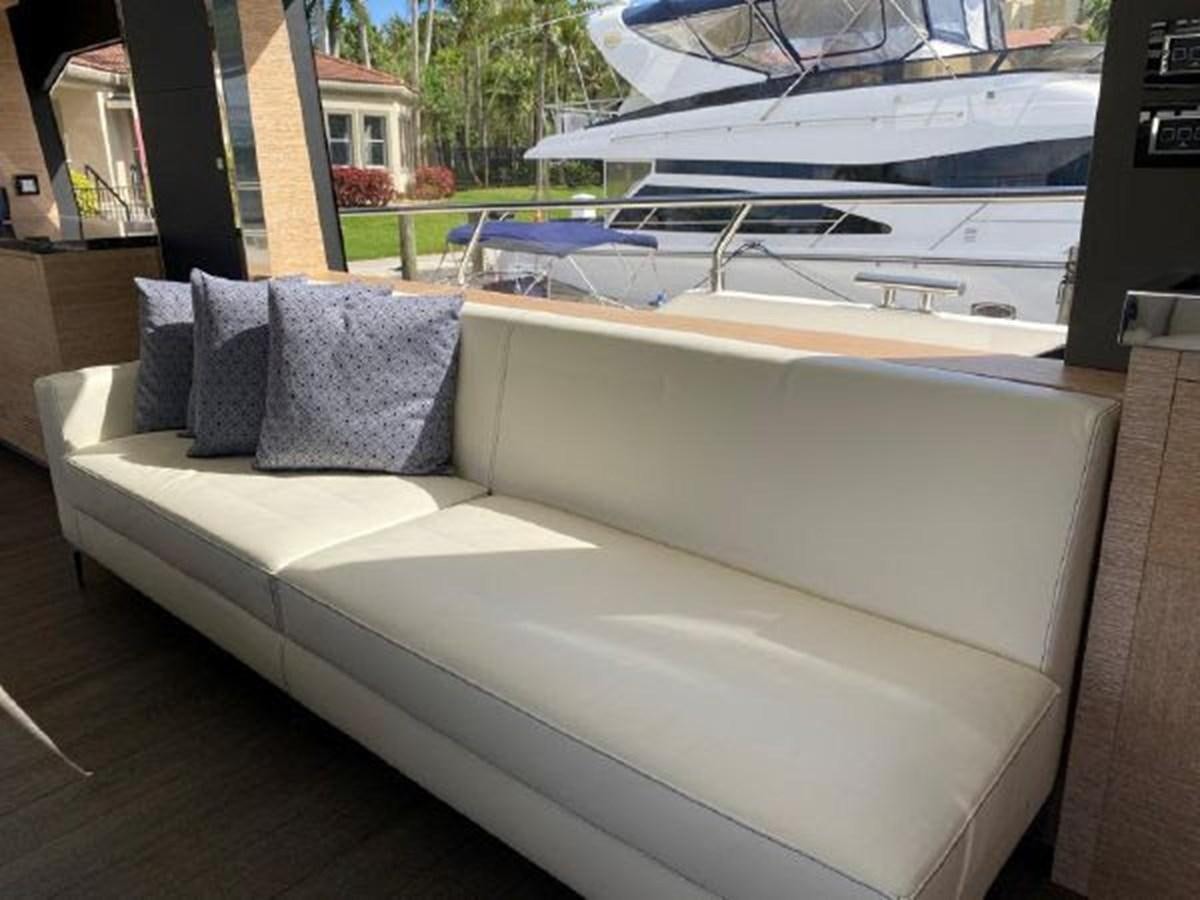 a couch in a room aboard THE ONLY BLUE 66 FLY Yacht for Sale