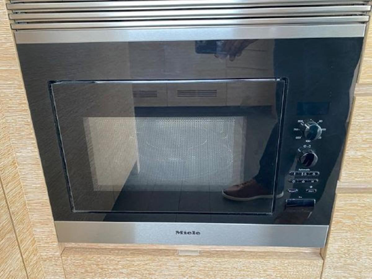 a black rectangular object with a silver frame aboard THE ONLY BLUE 66 FLY Yacht for Sale