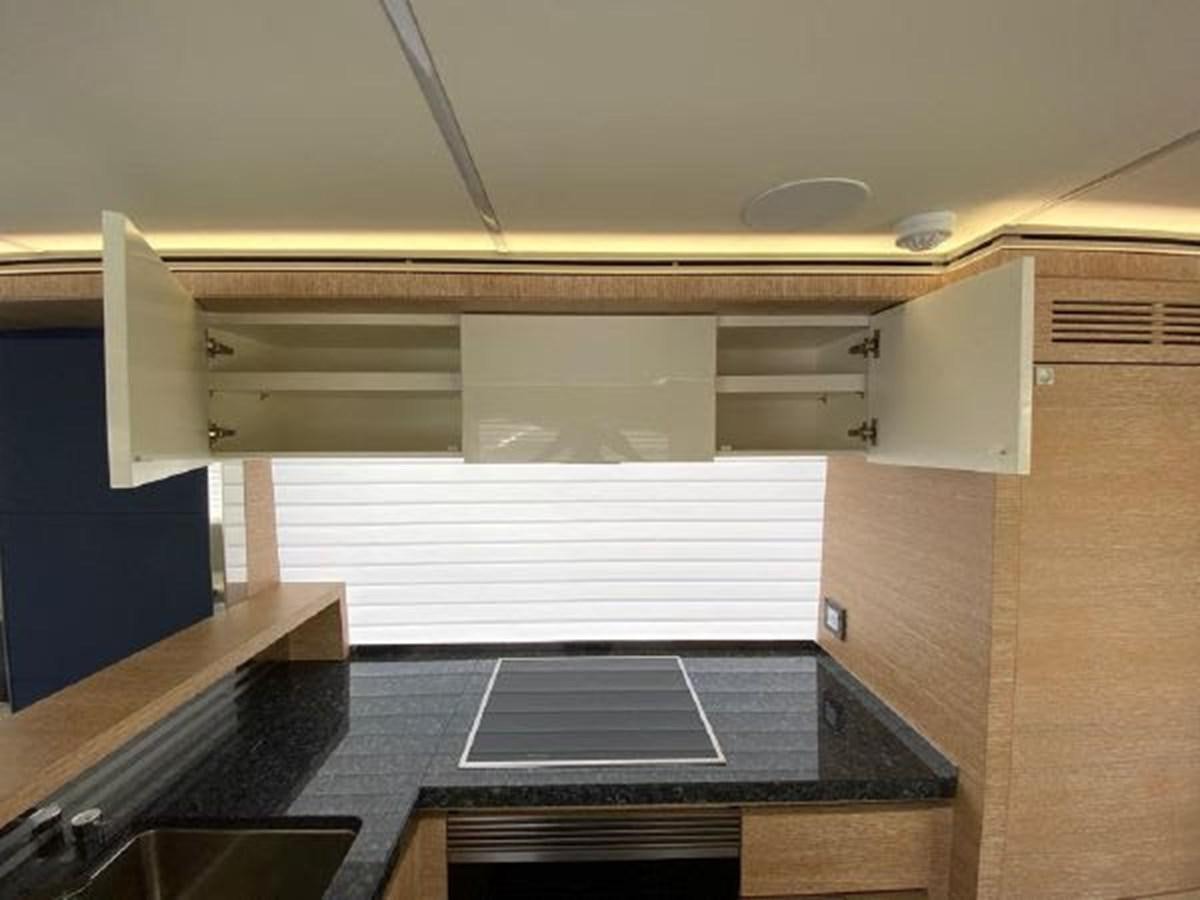 a room with a large black counter aboard THE ONLY BLUE 66 FLY Yacht for Sale