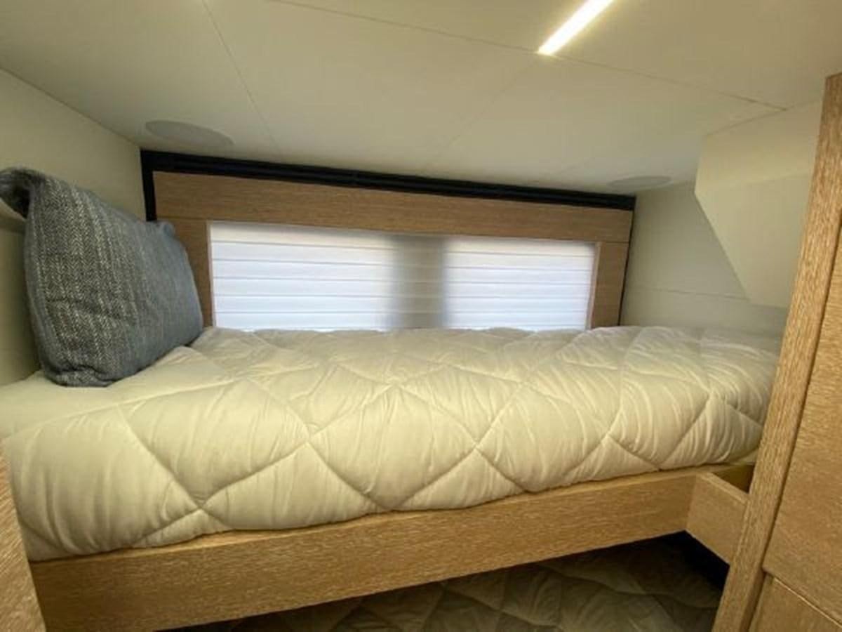 a couch in a room aboard THE ONLY BLUE 66 FLY Yacht for Sale