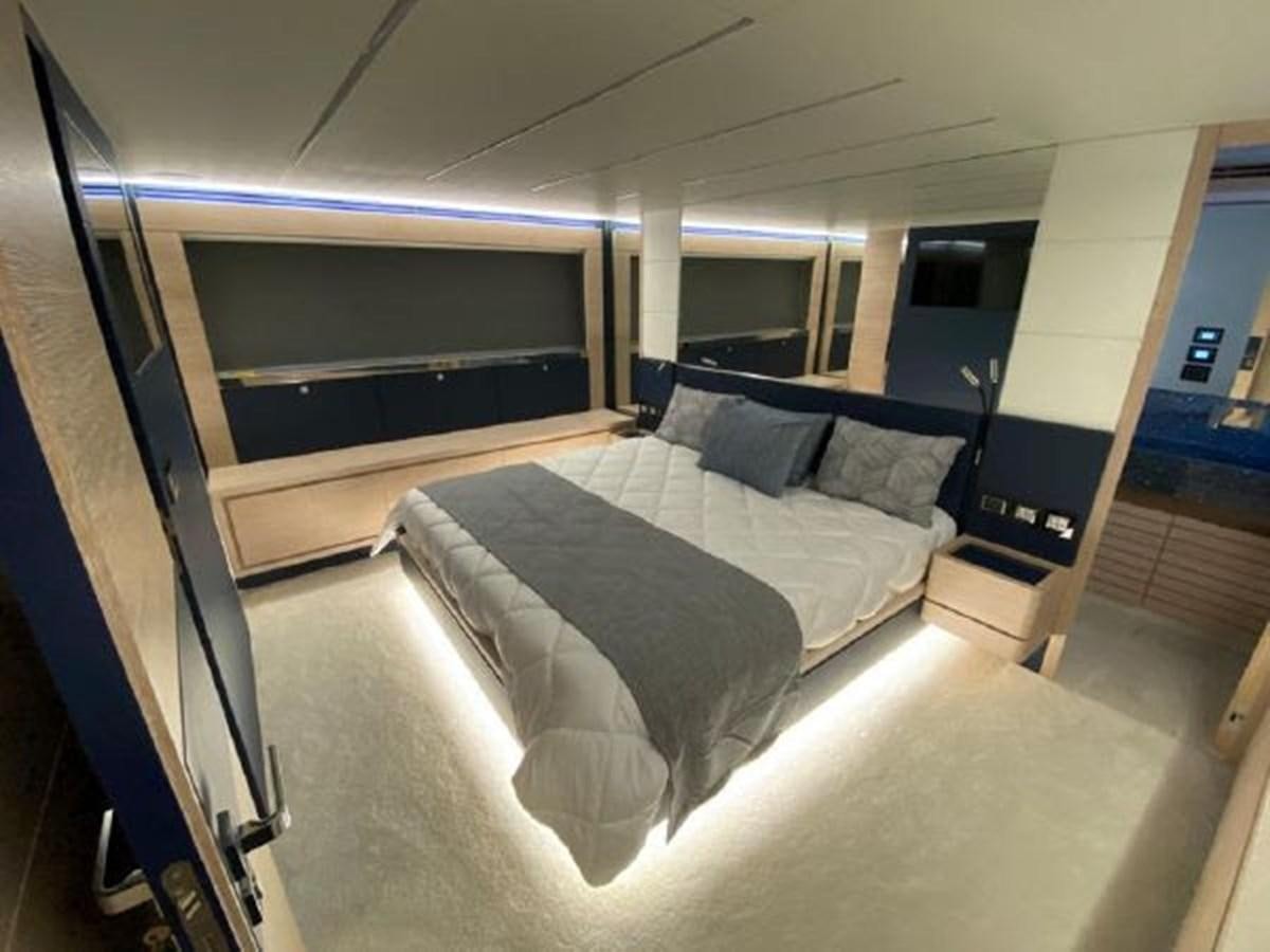 a bed in a room aboard THE ONLY BLUE 66 FLY Yacht for Sale