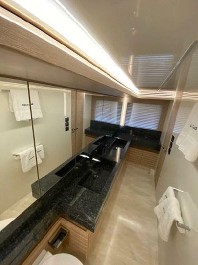 a bathroom with a large mirror aboard THE ONLY BLUE 66 FLY Yacht for Sale