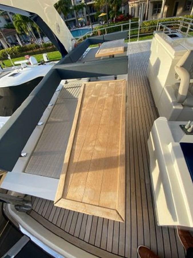 a wooden deck with a wood deck aboard THE ONLY BLUE 66 FLY Yacht for Sale