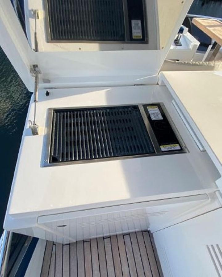 a white machine with a vent aboard THE ONLY BLUE 66 FLY Yacht for Sale