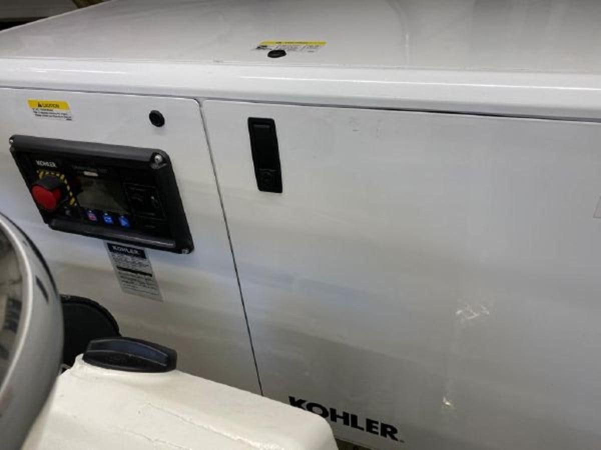 a white car with a black screen aboard THE ONLY BLUE 66 FLY Yacht for Sale